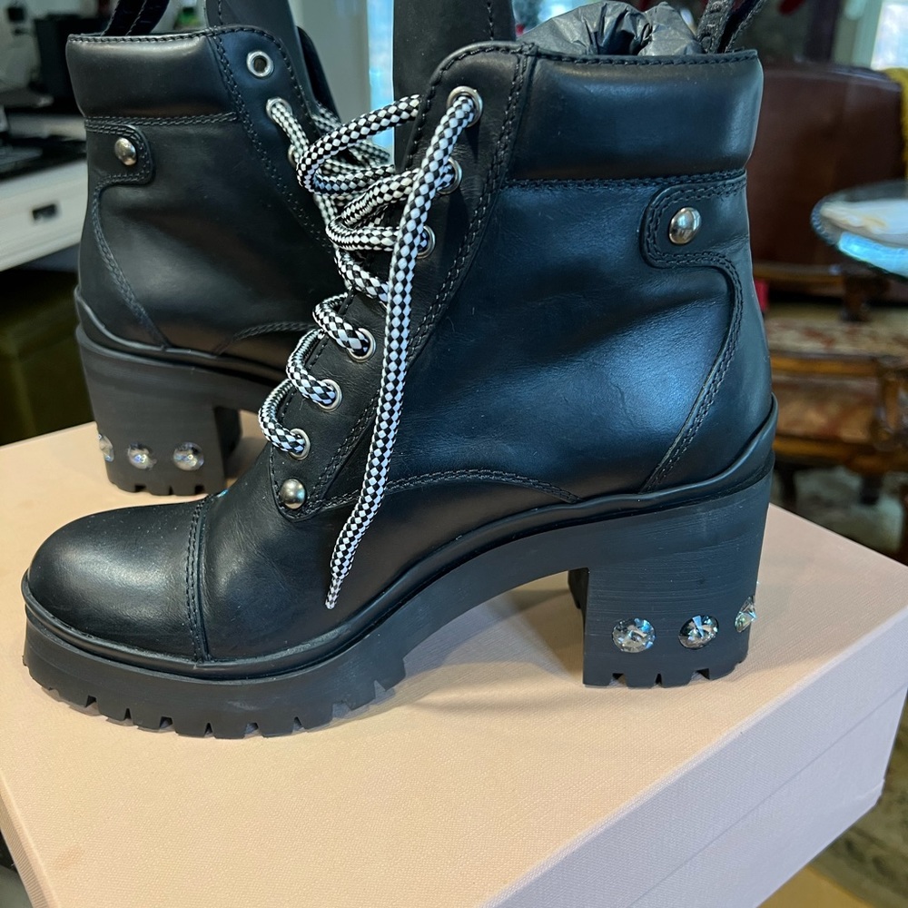 Miu Miu: Prada black leather booties string up with badazzled heel gently used